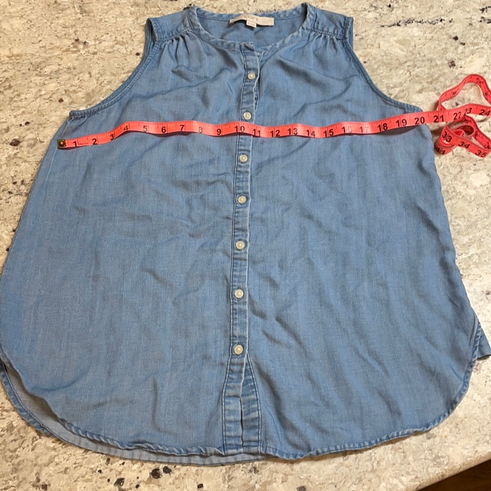 Loft sleeveless denim colored button down blouse.